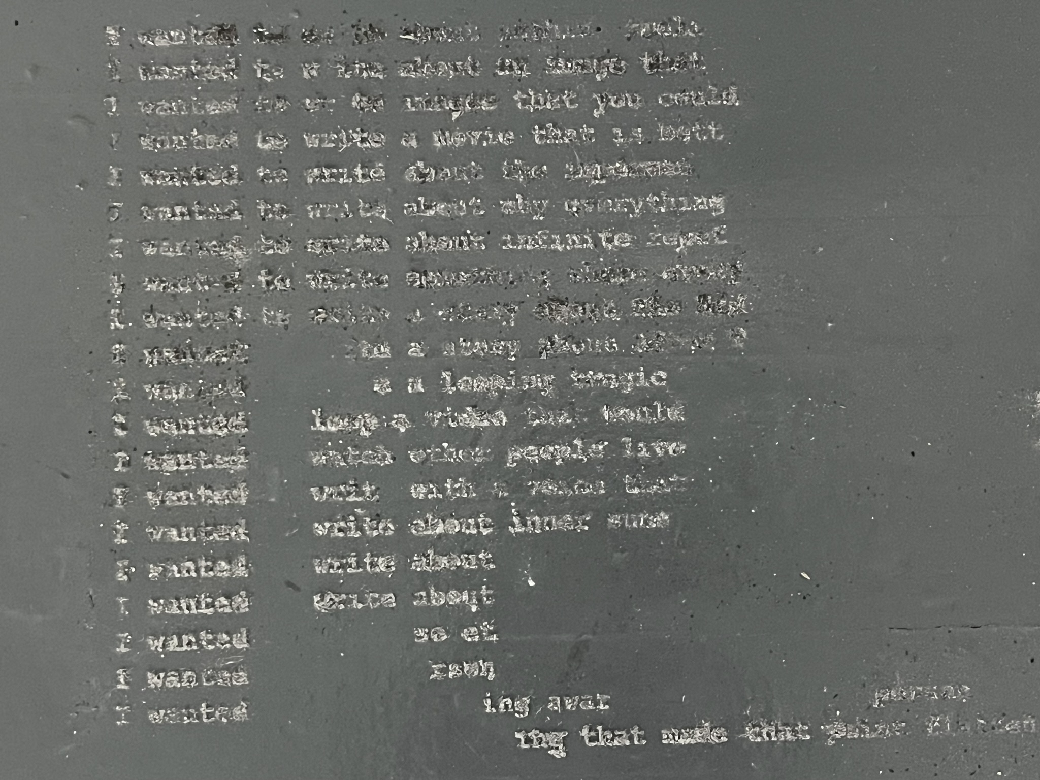 Block of text written in dust closeup