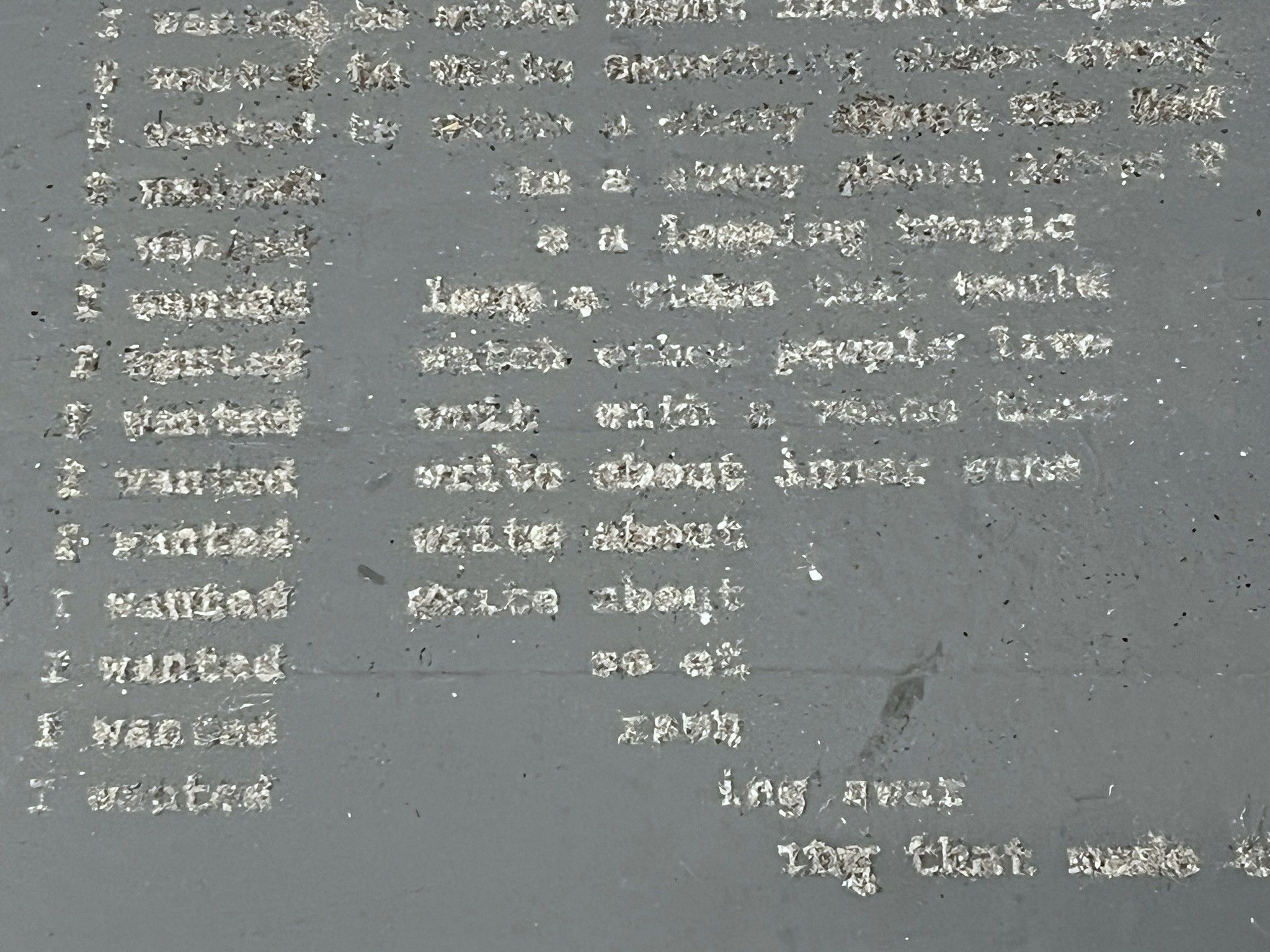 Block of text written in dust closeup