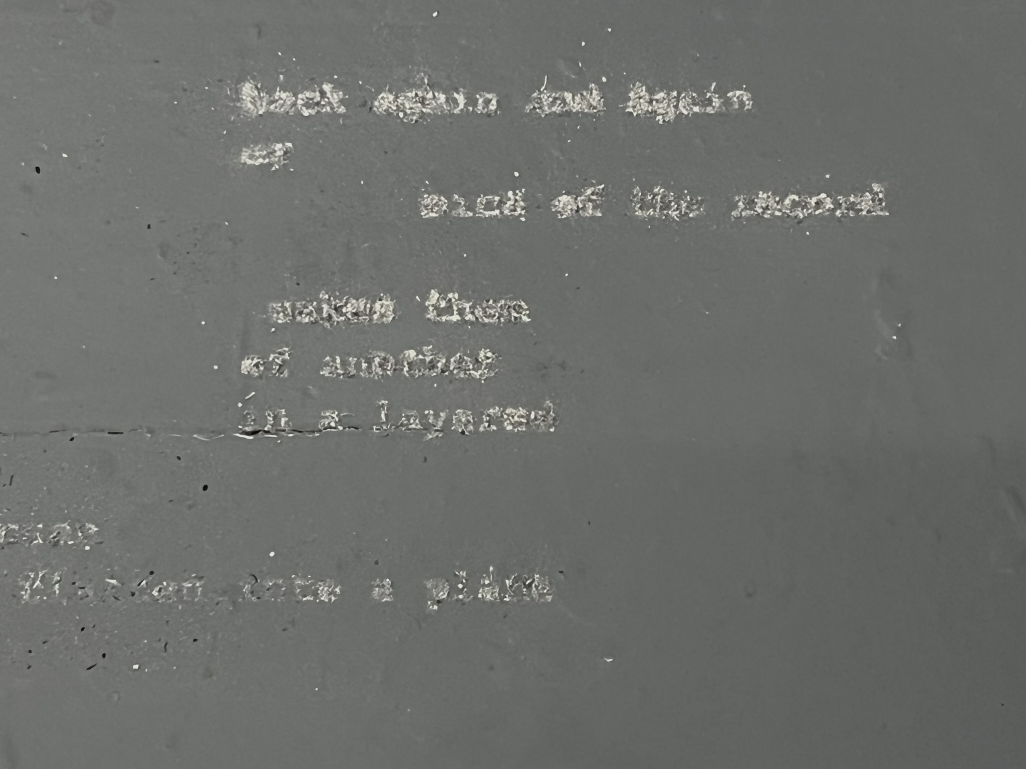 Block of text written in dust closeup