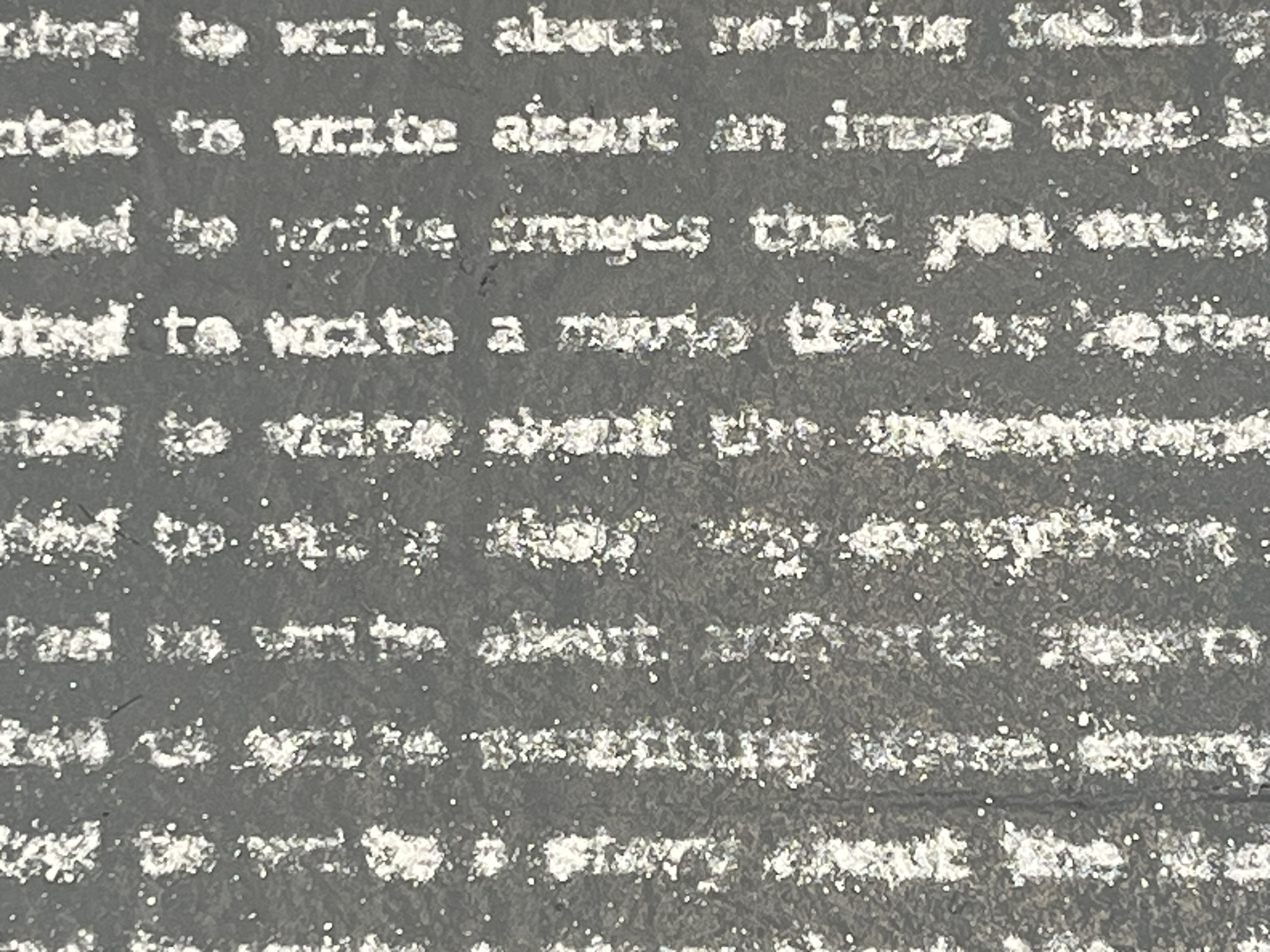 Three columns of text written in dust, taking up the room